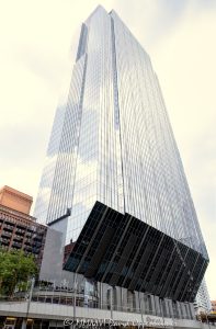 150 North Riverside Plaza office tower in downtown Chicago, Illinois, located along the Chicago River in the Loop business district. Contemporary commercial skyscraper architecture designed by Goettsch Partners featuring a distinctive cantilevered structural design, tapered base, reflective glass facade, and prominent riverfront positioning within Chicago’s financial district. The Class A office tower was engineered by Magnusson Klemencic Associates and developed above active rail lines serving Chicago Union Station. - © 2026 David Oppenheimer - Performance Impressions photography archives https://performanceimpressions.com 150 North Riverside, 150 North Riverside Plaza, 150 N Riverside, North Riverside Plaza, Riverside Plaza, Chicago, Chicago Illinois, Illinois, United States, Downtown Chicago, Chicago Loop, Chicago River, Chicago riverfront, architecture, Chicago architecture, architectural photography, urban architecture, modern architecture, contemporary architecture, skyscraper, high-rise, office tower, building, tower, office building, commercial building, corporate tower, commercial real estate, corporate real estate, real estate, business district, financial district, commercial architecture, corporate architecture, downtown, urban, riverfront architecture, riverfront tower, riverfront building, glass tower, glass building, glass facade, reflective glass, curtain wall, facade, reflections, river reflections, cantilever, cantilevered skyscraper, cantilevered design, tapered base, structural engineering, slender tower, iconic building, landmark, American architecture, Illinois architecture, exterior, daylight, waterfront, financial center, business center, Class A office building, office headquarters, Chicago skyscraper, Chicago office tower, glass skyscraper, riverwalk, Chicago riverwalk, modern skyscraper, contemporary skyscraper, downtown office tower, corporate headquarters, commercial tower, business architecture, Loop district, office architecture, urban development, financial district Chicago, Goettsch Partners, Magnusson Klemencic Associates, Clark Construction, Riverside Investment & Development, William Blair and Co, Hyatt Corporation, LEED Gold, WiredScore Platinum, 150 Media Stream, art, commercial art, tuning fork building, champagne flute building, commercial photography, fine art, image licensing, licensing, commercial imagery, vertical, David Oppenheimer, 1-15156784411