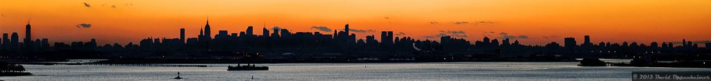 wide skyline photo of new york city at sundown