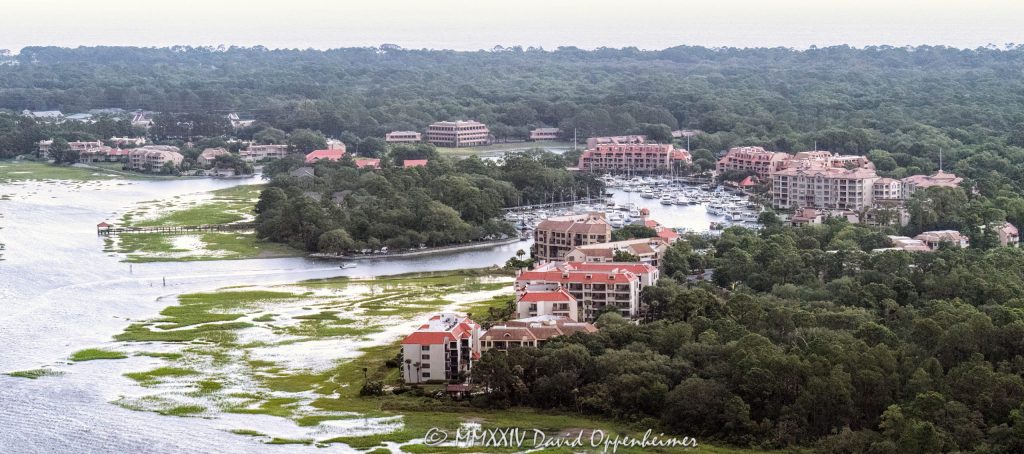 Shelter Cove Harbour & Marina at 1 Shelter Cove Ln on Hilton Head Island, South Carolina aerial view - © 2024 David Oppenheimer - Performance Impressions photography archives - https://performanceimpressions.com Shelter Cove Harbour & Marina, Shelter Cove Harbour & Marina aerial, Shelter Cove, harbor, marina, resort, marsh, marshlands, waterfront, bay, 1 Shelter Cove Ln, boating, yachts, Palmetto Dunes Resort, ocean resort, ocean, Shelter Cove Marina, docking, docks, Palmetto Dunes, Palmetto Dunes Oceanfront Resort, oceanfront, Hilton Head, Hilton Head Island, Hilton Head aerial, Hilton Head Island aerial, Broad Creek, Calibogue Sound, beach, coast, South Carolina coast, coastal, shoreline, shore, aerial, waterfront, dunes, beachfront, estuary, vacation, vacation homes, beach houses, tidal, creek, houses, beach homes, summer, summer homes, residences, properties, Atlantic Ocean, Town of Hilton Head, South Carolina, coastline, coastline aerial, luxury, Lowcountry, Hilton head island real estate, Hilton Head real estate, real estate, Hilton Head aerial, aerial photographer, aerial photography, photography, aerial view, aerial, 29928, David Oppenheimer, David Gordon Oppenheimer, United States, color, horizontal, 1-13726821381,