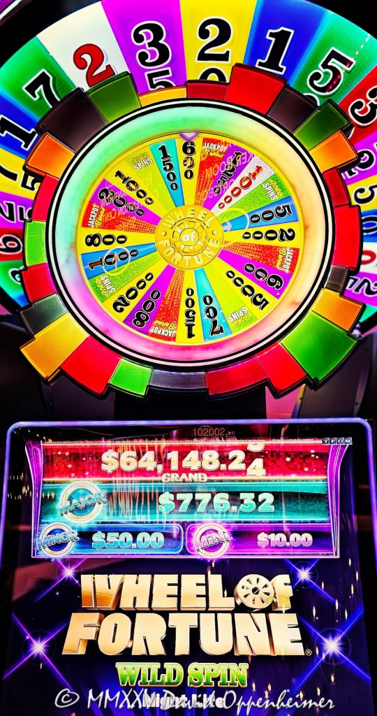 Wheel Of Fortune slot machine at The Venetian Casino by IGT in Las Vegas, Nevada - © 2025 David Oppenheimer - Performance Impressions casino photography archives - https://performanceimpressions.com Wheel Of Fortune slot machine, Wheel Of Fortune, wheel, Night Life, International Game Technology, IGT, slot machine, The Venetian, gaming, casino, Las Vegas, Nevada, slots, odds, win, gambling, wager, bet, luck, jackpot, gamble, quick spin, resort, American Gaming Association, AGA, 3355 S Las Vegas Blvd, 89109, bright, lights, colorful, United States, vertical, color, 1-14977862771