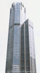 311 South Wacker Drive office tower in downtown Chicago, Illinois, located in the Loop near Willis Tower and Chicago Union Station. Postmodern commercial skyscraper architecture by Kohn Pedersen Fox featuring a granite and glass exterior, a distinctive cylindrical crown, and a large glass-ceilinged winter garden. Completed in 1990, the 65-story office tower was the tallest reinforced concrete structure in the world at the time of completion. - © 2026 David Oppenheimer - Performance Impressions photography archives https://performanceimpressions.com 311 South Wacker, 311 South Wacker Drive, 311 S Wacker, South Wacker Drive, Wacker Drive, Chicago, Chicago Illinois, Illinois, United States, 60606, Downtown Chicago, Chicago Loop, Chicago River, Willis Tower, Union Station, architecture, Chicago architecture, architectural photography, urban architecture, postmodern architecture, modern architecture, contemporary architecture, postmodern skyscraper, skyscraper, high-rise, office tower, building, tower, office building, commercial building, corporate tower, corporate headquarters, commercial real estate, corporate real estate, real estate, business district, financial district, commercial architecture, corporate architecture, downtown, urban, glass tower, glass building, glass facade, granite facade, granite exterior, reflective glass, curtain wall, facade, building exterior, reflections, iconic building, American architecture, Illinois architecture, exterior, daylight, financial center, business center, Class A office building, Chicago skyscraper, Chicago office tower, downtown office tower, commercial tower, office architecture, Loop district, Kohn Pedersen Fox, Kohn Pedersen Fox Associates, KPF, HKS, Lincoln Property Company, J A Jones Construction, reinforced concrete, concrete skyscraper, winter garden, glass ceiling, cylindrical crown, illuminated crown, crown, postmodern crown, commercial photography, commercial imagery, image licensing, licensing, photography licensing, David Oppenheimer, vertical, 1-15156784411