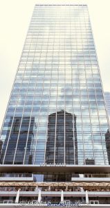 321 North Clark at Riverfront Plaza office tower in Chicago, Illinois, located on the north bank of the Chicago River in the River North business district. Modern commercial high-rise architecture designed by Skidmore, Owings & Merrill featuring a glass and steel exterior, riverfront positioning, and office space within the Riverfront Plaza development. Completed in 1987, the building was formerly known as Quaker Tower and later rebranded as 321 North Clark. - © 2026 David Oppenheimer - Performance Impressions photography archives https://performanceimpressions.com 321 North Clark, 321 North Clark Street, 321 N Clark, North Clark Street, Clark Street, 321 North Clark at Riverfront Plaza, Riverfront Plaza, Quaker Tower, Quaker Building, Chicago, RPM Seafood, Chicago Illinois, Illinois, United States, 60654, Downtown Chicago, River North, Chicago Loop, Chicago River, Chicago riverfront, architecture, Chicago architecture, architectural photography, urban architecture, modern architecture, contemporary architecture, modernist architecture, skyscraper, high-rise, office tower, building, tower, office building, commercial building, corporate tower, corporate headquarters, commercial real estate, corporate real estate, real estate, business district, financial district, commercial architecture, corporate architecture, downtown, urban, riverfront architecture, riverfront tower, riverfront office building, glass tower, glass building, glass facade, steel exterior, glass and steel, facade, building exterior, reflections, iconic building, American architecture, Illinois architecture, exterior, daylight, waterfront, financial center, business center, Class A office building, Chicago skyscraper, Chicago office tower, downtown office tower, commercial tower, office architecture, River North architecture, Loop district, riverfront plaza, public space, Skidmore Owings Merrill, Skidmore Owings and Merrill, SOM, Hines, BCE Development Properties, PCL Construction, American Bar Association, Quaker Oats, commercial photography, commercial imagery, image licensing, licensing, photography licensing, David Oppenheimer, vertical, 1-15156784411