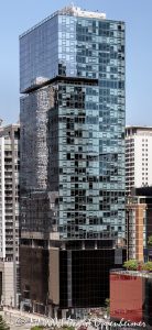 Aston Apartments at 200 East Illinois Street in Chicago, Illinois, located in the Streeterville neighborhood near Michigan Avenue, the Chicago Riverwalk, and Lake Michigan. Contemporary residential high-rise architecture designed by David Hovey of Optima, Inc. featuring a glass facade, dark glass podium, balconies, and luxury rental residences. The 42-story apartment building opened in 2013 and was formerly known as Optima Center Chicago – © 2026 David Oppenheimer – Performance Impressions photography archives https://performanceimpressions.com Aston Apartments, Aston Chicago, Aston Chicago Apartments, Aston Luxury Apartments, Aston, Optima Center, Optima Center Chicago, 200 East Illinois, 200 East Illinois Street, 200 E Illinois, East Illinois Street, Illinois Street, Chicago, Chicago Illinois, Illinois, United States, 60611, Streeterville, Downtown Chicago, Chicago Loop, Magnificent Mile, Michigan Avenue, Chicago Riverwalk, Lake Michigan, architecture, Chicago architecture, architectural photography, facade, building exterior, exterior, residential architecture, modern architecture, contemporary architecture, urban architecture, apartment tower, apartment building, rental apartments, luxury apartments, residential tower, residential building, high-rise, skyscraper, building, tower, glass tower, glass building, glass facade, dark glass, dark glass podium, curtain wall, balconies, balcony, podium, residential real estate, apartment real estate, Chicago real estate, real estate, downtown apartments, Streeterville apartments, Chicago apartments, luxury rentals, urban living, city living, mixed-use building, retail space, commercial architecture, downtown, urban, iconic building, American architecture, Illinois architecture, daylight, multifamily housing, Optima Inc, David Hovey, DeBartolo Development, Greystar, commercial photography, commercial imagery, image licensing, licensing, photography licensing, David Oppenheimer, vertical, 1-15156784411