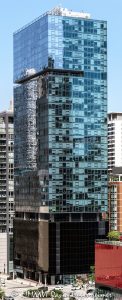 Aston Apartments at 200 East Illinois Street in Chicago, Illinois, located in the Streeterville neighborhood near Michigan Avenue, the Chicago Riverwalk, and Lake Michigan. Contemporary residential high-rise architecture designed by David Hovey of Optima, Inc. featuring a glass facade, dark glass podium, balconies, and luxury rental residences. The 42-story apartment building opened in 2013 and was formerly known as Optima Center Chicago – © 2026 David Oppenheimer – Performance Impressions photography archives https://performanceimpressions.com Aston Apartments, Aston Chicago, Aston Chicago Apartments, Aston Luxury Apartments, Aston, Optima Center, Optima Center Chicago, 200 East Illinois, 200 East Illinois Street, 200 E Illinois, East Illinois Street, Illinois Street, Chicago, Chicago Illinois, Illinois, United States, 60611, Streeterville, Downtown Chicago, Chicago Loop, Magnificent Mile, Michigan Avenue, Chicago Riverwalk, Lake Michigan, architecture, Chicago architecture, architectural photography, facade, building exterior, exterior, residential architecture, modern architecture, contemporary architecture, urban architecture, apartment tower, apartment building, rental apartments, luxury apartments, residential tower, residential building, high-rise, skyscraper, building, tower, glass tower, glass building, glass facade, dark glass, dark glass podium, curtain wall, balconies, balcony, podium, residential real estate, apartment real estate, Chicago real estate, real estate, downtown apartments, Streeterville apartments, Chicago apartments, luxury rentals, urban living, city living, mixed-use building, retail space, commercial architecture, downtown, urban, iconic building, American architecture, Illinois architecture, daylight, multifamily housing, Optima Inc, David Hovey, DeBartolo Development, Greystar, commercial photography, commercial imagery, image licensing, licensing, photography licensing, David Oppenheimer, vertical, 1-15156784411