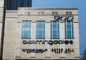 Bloomingdale’s Department Store at 900 North Michigan Shops fronts Chicago’s Magnificent Mile at 900 North Michigan Avenue, with Aster Hall and Topgolf Swing Suite signs visible on the exterior. The store anchors the retail center within the mixed-use tower designed by Kohn Pedersen Fox with Perkins&Will, which also includes offices, private residences, and Four Seasons Hotel Chicago – © 2026 David Oppenheimer – Performance Impressions photography archives https://performanceimpressions.com Bloomingdale’s at 900 North Michigan, Bloomingdale’s Department Store, Bloomingdale’s Chicago, Bloomingdale’s North Michigan Avenue, Bloomingdale’s Michigan Avenue, Bloomingdale’s 900 North Michigan, Bloomingdale’s Building, 900 North Michigan Shops, 900 North Michigan, 900 North Michigan Avenue, 900 N Michigan Avenue, 900 N Michigan Ave, 900 Shops, 900 Shops Chicago, North Michigan Avenue, Michigan Avenue, Magnificent Mile, Mag Mile, Gold Coast, Gold Coast Chicago, Near North Side, downtown Chicago, Chicago Illinois, Chicago IL, Illinois, East Walton Street, Walton Street, East Delaware Place, Delaware Place, 60611, facade, building exterior, exterior, retail facade, department store facade, storefront, store exterior, limestone facade, glass facade, green glass, postmodern facade, signage, building signs, Aster Hall sign, Topgolf sign, shopping center, shopping mall, retail center, retail complex, luxury shopping, Chicago shopping, Michigan Avenue shopping, Magnificent Mile shopping, Gold Coast shopping, shopping, retail, department store, store, fashion, luxury retail, commercial building, mixed use building, mixed use tower, skyscraper, high rise, tower, building, offices, private residences, condominiums, condos, real estate, Chicago real estate, commercial real estate, retail real estate, Magnificent Mile real estate, Aster Hall, Aster Hall Chicago, Aster Hall Food Hall, food hall, dining, restaurants, Topgolf Swing Suite, Top Golf Swing Suite, 900 Swing Suite, Topgolf Chicago, indoor golf, golf simulator, sports simulator, entertainment, Four Seasons Hotel Chicago, Four Seasons Chicago, Four Seasons Hotels and Resorts, Bloomingdale’s, Macy’s Inc, Macy’s, Kohn Pedersen Fox, KPF, Perkins&Will, Perkins and Will, JMB Realty, JMB Realty Corporation, Urban Retail Properties, Alfred Benesch, postmodern architecture, retail architecture, commercial architecture, Chicago architecture, architectural photography, Illinois architecture, United States, licensing, image licensing, commercial imagery, photography licensing, art, print, fine art, commercial photography, David Oppenheimer, horizontal, 1-15213827141