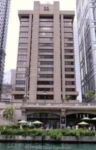 55 West Wacker office building in Chicago, Illinois, located along the Chicago River in the Loop business district. Brutalist commercial architecture designed by C.F. Murphy Associates featuring a concrete facade, deep-set windows, and a strong riverfront office presence near Wacker Drive and Dearborn Street. Built in 1968 as the Blue Cross Blue Shield of Illinois headquarters, the 16-story building is also historically known as the Blue Cross-Blue Shield Building – © 2026 David Oppenheimer – Performance Impressions photography archives https://performanceimpressions.com 55 West Wacker, 55 West Wacker Drive, 55 W Wacker, West Wacker Drive, Wacker Drive, Blue Cross-Blue Shield Building, Blue Cross Blue Shield Building, former Blue Cross Blue Shield headquarters, Blue Cross Blue Shield of Illinois, Chicago, Chicago Illinois, Illinois, United States, 60601, Downtown Chicago, Chicago Loop, Chicago River, Chicago riverfront, architecture, Chicago architecture, architectural photography, facade, building exterior, exterior, Brutalist architecture, brutalism, concrete facade, concrete building, concrete tower, deep-set windows, recessed windows, modern architecture, commercial architecture, office architecture, office tower, office building, commercial building, building, tower, high-rise, commercial real estate, corporate real estate, real estate, business district, financial district, corporate architecture, downtown, urban, riverfront architecture, riverfront building, riverfront office building, iconic building, American architecture, Illinois architecture, daylight, waterfront, financial center, business center, Class A office building, Chicago office tower, downtown office tower, C.F. Murphy Associates, CF Murphy Associates, C F Murphy Associates, Pearl Properties, Taipei Economic and Cultural Office, TECO Chicago, commercial photography, commercial imagery, image licensing, licensing, photography licensing, David Oppenheimer, vertical, 1-15156784411