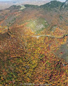 Linn Cove Viaduct on the Blue Ridge Parkway below Grandfather Mountain State Park with Autumn Colors in Western North Carolina Aerial View