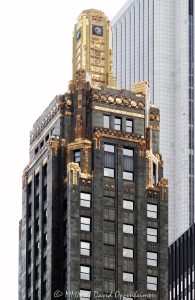 Carbide and Carbon Building at 230 North Michigan Avenue in Chicago, Illinois, located on Michigan Avenue in the Loop. Historic Art Deco high-rise architecture designed by Burnham Brothers featuring a polished black granite base, dark green terra cotta facade, bronze trim, and gold leaf accents. Built in 1929 as the regional office of Union Carbide and Carbon Company, the Chicago Landmark building now houses Pendry Chicago hotel – © 2026 David Oppenheimer – Performance Impressions photography archives https://performanceimpressions.com Carbide and Carbon Building, Carbide & Carbon Building, Carbon and Carbide Building, Carbide Carbon Building, Pendry Chicago, Pendry Hotel Chicago, St Jane Hotel, St Jane Chicago, Hard Rock Hotel Chicago, Union Carbide Building, Union Carbide and Carbon Company, Union Carbide, 230 North Michigan, 230 North Michigan Avenue, 230 N Michigan, North Michigan Avenue, Michigan Avenue, Chicago, Chicago Illinois, Illinois, United States, 60601, Downtown Chicago, Chicago Loop, Loop, architecture, Chicago architecture, architectural photography, facade, building exterior, exterior, Art Deco, Art Deco architecture, historic architecture, landmark building, Chicago Landmark, historic building, hotel architecture, hospitality architecture, commercial architecture, high-rise, skyscraper, building, tower, hotel building, luxury hotel, boutique hotel, black granite, granite facade, green terra cotta, terra cotta facade, gold leaf, bronze trim, decorative facade, dark facade, classical details, urban architecture, downtown, urban, American architecture, Illinois architecture, daylight, Chicago hotel, downtown hotel, Michigan Avenue hotel, Loop hotel, Pendry, Montage International, Burnham Brothers, Daniel Burnham, Hubert Burnham, Daniel Burnham Jr, Paschen Brothers, Lucien Lagrange, commercial photography, commercial imagery, image licensing, licensing, photography licensing, David Oppenheimer, vertical, 1-15156784411
