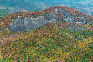 Cedar Rock Mountain Cliffs in DuPont State Recreational Forest with Autumn Colors Aerial View