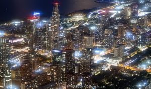 Burnham Place and Central Station area night aerial photo in Chicago, Illinois, showing city lights, residential towers, streets, and neighborhood development in the Near South Side, South Loop, and Prairie District area near Grant Park and Museum Campus. The view includes Central Station, NEMA Chicago, One Museum Park, The Grant Luxury Condos, and 1000M Apartments at Grant Park, with residential high-rise development and street lighting visible throughout the area – © 2026 David Oppenheimer – Performance Impressions aerial photography archives https://performanceimpressions.com Burnham Place, Central Station, Central Station Chicago, Near South Side, South Loop, Prairie District, Prairie Avenue District, Museum Park, Grant Park, Museum Campus, 1000M, 1000M Apartments, 1000M Apartments at Grant Park, 1000 South Michigan, 1000 South Michigan Avenue, 1000 S Michigan, Helmut Jahn, Jahn, NEMA Chicago, NEMA, 1210 South Indiana, 1210 South Indiana Avenue, 1210 S Indiana, One Museum Park, One Museum Park East, The Grant, The Grant Luxury Condos, 1201 South Prairie, 1201 S Prairie, Chicago, Chicago Illinois, Illinois, United States, 60605, Downtown Chicago, Chicago Loop, Chicago lakefront, Lake Michigan, Michigan Avenue, Roosevelt Road, 18th Street, residential district, residential towers, apartment towers, condo towers, high-rise, skyscraper, building, tower, city lights, nighttime, night aerial, aerial, aerial photo, aerial photograph, aerial photography, aerial photographer, aerial view, aerial image, urban lights, street lights, building lights, neighborhood lights, night photography, night photo, city at night, Chicago at night, urban night, neighborhood, Chicago neighborhood, urban development, redevelopment, real estate, residential real estate, Chicago real estate, residential architecture, urban architecture, Chicago architecture, architecture, street grid, streets, roads, traffic, urban planning, city planning, former rail yards, rail yards, air rights, South Loop real estate, Central Station real estate, Prairie District real estate, documentary photography, editorial photography, commercial photography, commercial imagery, image licensing, licensing, photography licensing, David Oppenheimer, horizontal, 1-15156784411