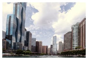 Chicago Riverwalk and downtown waterfront skyline in Chicago, Illinois, featuring the Chicago River, modern high-rise buildings, glass towers, riverfront architecture, and the downtown cityscape. Visible buildings include St. Regis Chicago, The Regatta at 420 East Waterside Drive, The Chandler Condominiums, Cityfront Place, Swissotel Chicago, Trump International Hotel and Tower, 303 East Wacker, Columbus Plaza, and Hyatt Regency Chicago. Horizontal daytime view from the river – © 2026 David Oppenheimer – Performance Impressions photography archives https://performanceimpressions.com Chicago Riverwalk, Chicago River, downtown waterfront, waterfront skyline, Chicago skyline, Chicago River skyline, cityscape, Chicago cityscape, riverfront, waterfront, river, skyline, downtown skyline, St. Regis Chicago, St Regis Chicago, Vista Tower, 401 East Wacker, 401 E Wacker, Studio Gang, Jeanne Gang, The Regatta, Regatta Condominiums, 420 East Waterside, 420 East Waterside Drive, 420 E Waterside, The Chandler, The Chandler Condominiums, 450 East Waterside, 450 East Waterside Drive, 450 E Waterside, Cityfront Place, 400 North McClurg, 400 North McClurg Court, 400 N McClurg, Swissotel Chicago, Swissotel Chicago, 323 East Wacker, 323 East Wacker Drive, 323 E Wacker, Trump International Hotel and Tower, Trump Tower Chicago, Trump Tower, 401 North Wabash, 401 N Wabash, 303 East Wacker, 303 East Wacker Drive, 303 E Wacker, Three Illinois Center, Columbus Plaza, Hyatt Regency Chicago, 151 East Wacker, 151 East Wacker Drive, 151 E Wacker, Chicago, Chicago Illinois, Illinois, United States, 60601, Downtown Chicago, Chicago Loop, New Eastside, Lakeshore East, Streeterville, Lake Michigan, architecture, Chicago architecture, architectural photography, facade, building exterior, exterior, urban architecture, modern architecture, contemporary architecture, skyscraper, high-rise, building, tower, glass tower, glass building, glass facade, residential tower, condo tower, hotel tower, office tower, luxury condos, Chicago real estate, residential real estate, commercial real estate, urban, downtown, daylight, photorealistic, digital art, artwork, commercial photography, commercial imagery, image licensing, licensing, photography licensing, David Oppenheimer, horizontal, 1-15156784411