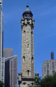 Historic Chicago Water Tower on Michigan Avenue Chicago Water Tower at 806 North Michigan Avenue in Chicago, Illinois, shown in a vertical daytime view emphasizing its limestone stonework, castellated Gothic Revival detailing, turrets, pointed arches, and tower profile. Designed by William W. Boyington to house a standpipe for the Chicago Avenue waterworks system, the landmark survived the Great Chicago Fire of 1871 and remains a defining structure on the Magnificent Mile – © 2026 David Oppenheimer – Performance Impressions photography archives https://performanceimpressions.com Chicago Water Tower, Historic Chicago Water Tower, Chicago Avenue Water Tower, Chicago Avenue Water Tower and Pumping Station, 806 North Michigan Avenue, 806 N Michigan Avenue, North Michigan Avenue, Michigan Avenue, Magnificent Mile, Mag Mile, Near North Side, Streeterville, Jane M Byrne Plaza, Chicago, Chicago Illinois, Chicago IL, Illinois, 60611, facade, building exterior, exterior, tower exterior, stone facade, limestone facade, stonework, masonry, limestone, Joliet limestone, Lemont limestone, Gothic Revival, Gothic Revival architecture, castellated Gothic, historic architecture, landmark architecture, Chicago architecture, vertical architecture, architecture, architectural photography, tower, water tower, historic tower, standpipe, standpipe tower, waterworks, water supply, municipal infrastructure, infrastructure, Chicago Water Works, Chicago Avenue Pumping Station, City Gallery, City Gallery in the Historic Water Tower, Water Tower Place, Great Chicago Fire, fire survivor, Chicago history, historic landmark, Chicago Landmark, National Register of Historic Places, Old Chicago Water Tower District, American Water Landmark, William W Boyington, William Boyington, Ellis S Chesbrough, pointed arches, lancet windows, crenellations, battlements, turrets, spire, buttresses, parapet, ornate stone, daytime, daylight, tourism, travel, destination, landmark, historic, building, United States, licensing, image licensing, commercial imagery, photography licensing, art, print, fine art, commercial photography, David Oppenheimer, vertical, 1-15213827141