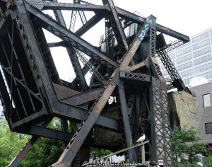 Chicago and North Western Railway Kinzie Street Bridge raised over the North Branch of the Chicago River in downtown Chicago, Illinois. Historic single-leaf bascule railroad bridge near Kinzie Street and Canal Street, also known as the Carroll Avenue Bridge, built in 1908 and designated a Chicago Landmark in 2007. The raised steel bridge is a former Chicago and North Western railroad span now owned by Union Pacific – © 2026 David Oppenheimer – Performance Impressions photography archives https://performanceimpressions.com Chicago and North Western Railway Bridge, Chicago & North Western Railway Bridge, Chicago and North Western Railroad Bridge, Chicago & North Western Railroad Bridge, Kinzie Street railroad bridge, Kinzie Street Railroad Bridge, Kinzie Street Bridge, Carroll Avenue Bridge, C&NW bridge, C&NW railroad bridge, Union Pacific bridge, Union Pacific Railroad, raised bridge, bridge, raised railroad bridge, open bridge, bascule bridge, single-leaf bascule bridge, railroad bridge, railway bridge, rail bridge, train bridge, steel bridge, steel girders, bridge girders, metal girders, steel truss, truss bridge, railroad truss, steel structure, bridge structure, riveted steel, steelwork, historic bridge, landmark bridge, Chicago Landmark, Chicago bridge, Chicago bridges, Chicago railroad bridge, Chicago railway bridge, Chicago River bridge, Chicago River, North Branch Chicago River, North Branch, Kinzie Street, Canal Street, Wolf Point, downtown Chicago, Chicago Loop, River North, Near West Side, Chicago, Chicago Illinois, Illinois, United States, 60654, architecture, Chicago architecture, architectural photography, bridge architecture, engineering, civil engineering, structural engineering, industrial architecture, transportation, transportation infrastructure, rail infrastructure, railroad infrastructure, railway infrastructure, railroad history, railway history, Chicago history, industrial history, historic infrastructure, urban infrastructure, bridge photography, railroad photography, rail photography, infrastructure photography, documentary photography, editorial photography, commercial photography, commercial imagery, image licensing, licensing, photography licensing, David Oppenheimer, horizontal, 1-15156784411