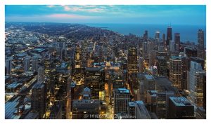Chicago skyline and city lights at night from Willis Tower in Chicago, Illinois, looking north across downtown toward the Gold Coast, Streeterville, River North, and the Near North Side. Night aerial-style view from the former Sears Tower showing the Chicago Loop, financial district, West Loop Gate, Chicago River, high-rise buildings, illuminated streets, and downtown neighborhoods – © 2026 David Oppenheimer – Performance Impressions aerial photography archives https://performanceimpressions.com Chicago skyline, Chicago skyline at night, Chicago city lights, city lights, night skyline, nighttime skyline, Chicago at night, downtown Chicago, Chicago downtown, Chicago Loop, Loop, financial district, West Loop Gate, West Loop, Near North Side, River North, Streeterville, Gold Coast, Magnificent Mile, Michigan Avenue, Chicago River, Chicago Riverwalk, Lake Michigan, Chicago lakefront, skyline, cityscape, Chicago cityscape, aerial, aerial photo, aerial photography, aerial photographer, aerial view, aerial image, night aerial, nighttime aerial, night photography, night photo, city at night, urban night, illuminated city, illuminated streets, street lights, building lights, high-rise, high-rises, skyscraper, skyscrapers, building, tower, architecture, Chicago architecture, urban architecture, modern architecture, contemporary architecture, downtown skyline, urban skyline, office towers, residential towers, condo towers, hotel towers, glass towers, glass buildings, city from above, Willis Tower, Sears Tower, former Sears Tower, Skydeck Chicago, 233 South Wacker, 233 South Wacker Drive, 233 S Wacker, South Wacker Drive, Wacker Drive, North Michigan Avenue, urban planning, city planning, travel photography, tourism, destination, Midwest city, Midwest skyline, Illinois, Chicago Illinois, United States, commercial photography, commercial imagery, image licensing, licensing, photography licensing, art, print, fine art, David Oppenheimer, horizontal, 1-15156784411