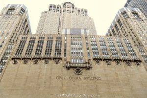 Civic Opera Building and Lyric Opera House on Chicago River Civic Opera Building and Lyric Opera House at 20 North Wacker Drive in Chicago, Illinois, seen from the Chicago River in the Loop business district. Historic Art Deco commercial and performing arts architecture designed by Graham, Anderson, Probst & White featuring a limestone facade, riverfront massing, office tower, and opera house for Lyric Opera of Chicago. The 1929 building is also associated with The Florian at Lyric Opera and is designated a Chicago Landmark – © 2026 David Oppenheimer – Performance Impressions photography archives https://performanceimpressions.com Civic Opera Building, Civic Opera House, Lyric Opera House, Lyric Opera of Chicago, Chicago Civic Opera, The Florian, The Florian at Lyric Opera, Florian Chicago, 20 North Wacker, 20 North Wacker Drive, 20 N Wacker, Twenty North Wacker, North Wacker Drive, Wacker Drive, Chicago River, Chicago riverfront, Chicago Riverwalk, Chicago, Chicago Illinois, Illinois, United States, 60606, Downtown Chicago, Chicago Loop, Loop, financial district, architecture, Chicago architecture, architectural photography, facade, building exterior, exterior, Art Deco, Art Deco architecture, historic architecture, landmark building, Chicago Landmark, historic building, limestone facade, stone facade, riverfront architecture, performing arts, opera house, opera, theater, theatre, office tower, office building, commercial building, building, tower, high-rise, commercial real estate, corporate real estate, real estate, business district, downtown, urban, waterfront, daylight, American architecture, Illinois architecture, Graham Anderson Probst White, Graham Anderson Probst and White, Graham Anderson, Probst and White, GAPW, Samuel Insull, Henry Hering, Kemper Insurance Building, commercial photography, commercial imagery, image licensing, licensing, photography licensing, art, print, fine art, David Oppenheimer, horizontal, 1-15156784411