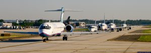 Commercial Passenger Planes in Line Waiting for Takeoff
