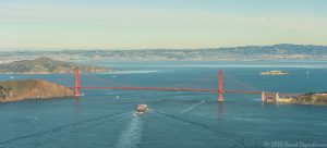 Container Ship Under the Golden Gate Bridge in San Francisco Aerial View