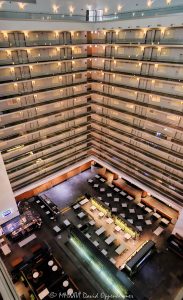 Embassy Suites by Hilton Chicago Downtown Magnificent Mile Elevated Atrium View Elevated view across the atrium interior of Embassy Suites by Hilton Chicago Downtown Magnificent Mile in Streeterville, Chicago, Illinois, looking down from an upper level toward the hotel’s lower dining and public areas. Approximately twelve visible levels of open guestroom corridors extend around the vast central atrium, with angled walkways meeting at a corner and repeating railings, floor edges, horizontal lines and diagonal geometry defining the multi-story interior – © 2026 David Oppenheimer – Performance Impressions photography archives https://performanceimpressions.com Embassy Suites by Hilton Chicago Downtown Magnificent Mile, Embassy Suites Chicago Downtown Magnificent Mile, Embassy Suites Chicago Magnificent Mile, Embassy Suites Magnificent Mile, Embassy Suites Chicago, Embassy Suites by Hilton, Embassy Suites, Chicago Embassy Suites, 511 North Columbus Drive, 511 N Columbus Drive, 511 N Columbus Dr, 60611, Embassy Suites atrium, Embassy Suites interior, hotel atrium, Chicago hotel atrium, atrium interior, Chicago hotel interior, hotel interior, elevated atrium view, elevated view, upper floor view, high angle view, atrium overview, atrium view, looking down, open atrium, central atrium, multi-story atrium, multistory atrium, multi-level atrium, tall atrium, large atrium, vast atrium, vast interior, open interior, open volume, atrium architecture, interior architecture, hotel architecture, hospitality architecture, hospitality design, interior design, commercial interior, commercial architecture, guestroom corridors, guest corridors, hotel corridors, atrium corridors, open corridors, gallery corridors, interior corridors, hotel hallways, interior hallways, walkways, interior walkways, open walkways, angled walkways, diagonal walkways, corner walkways, intersecting corridors, corridor junction, stacked corridors, stacked floors, multiple floors, multiple levels, upper floors, hotel floors, guestroom levels, guestroom doors, room doors, railings, corridor railings, floor edges, atrium floor, lower floor, lower level, main level, hotel dining, dining area, dining space, hotel dining area, public areas, public space, common areas, seating area, hotel interior space, horizontal lines, vertical lines, diagonal lines, angled lines, converging lines, repeating lines, architectural lines, linear architecture, linear geometry, architectural geometry, geometric architecture, geometric interior, geometric design, corner geometry, repeating geometry, architectural pattern, repetition, pattern, symmetry, perspective, elevated perspective, interior perspective, depth, spatial depth, architectural depth, abstract architecture, architectural abstraction, geometric abstraction, abstract interior, architectural abstract, modern geometry, structural geometry, interior structure, building structure, structural design, structural engineering, architectural engineering, engineering, contemporary architecture, contemporary interior, contemporary design, Art Deco, Art Deco architecture, Art Deco interior, Art Deco influence, modern Art Deco, retro, retro design, retro interior, 2000s architecture, hotel design, all-suite hotel, all suite hotel, upscale hotel, full service hotel, Chicago hotel, downtown Chicago hotel, Magnificent Mile hotel, Streeterville hotel, Chicago hospitality, Streeterville, River East, River East Chicago, Magnificent Mile, downtown Chicago, Near North Side, Columbus Drive, Chicago, Chicago Illinois, Illinois, United States, USA, Embassy Suites Chicago Downtown-Lakefront, Embassy Suites Downtown Lakefront, Chicago Downtown Lakefront, DeStefano + Partners, DeStefano and Partners, DeStefano Partners, Greg Randall, architect, architects, architecture firm, The Gettys Group, Gettys Group, Gettys, interior designer, MCL Companies, MCL, developer, Hilton, Hilton Hotels, Hilton Worldwide, Hilton Worldwide Holdings, HLT, NYSE HLT, Hilton stock, Host Hotels & Resorts, Host Hotels, Host Hotels and Resorts, HST, NASDAQ HST, hotel REIT, hospitality, hotel, atrium, interior, architecture, structure, geometry, geometric, corridors, hallway, walkways, railings, architectural photography, interior photography, hotel photography, atrium photography, geometric photography, abstract photography, Chicago architecture photography, structural photography, fine art photography, architectural print, photographic print, archival print, gallery print, collector print, wall art, Chicago architecture art, hotel art, atrium art, abstract art, geometric art, licensing, image licensing, commercial imagery, photography licensing, art, print, fine art, commercial photography, David Oppenheimer, David Oppenheimer photography, Performance Impressions, Performance Impressions photography archives, horizontal, 1-15213827141