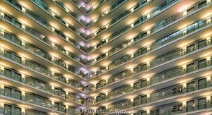 Embassy Suites by Hilton Chicago Downtown Magnificent Mile Abstract Atrium View Embassy Suites by Hilton Chicago Downtown Magnificent Mile atrium interior in Streeterville, Chicago, Illinois, looking upward at angled guestroom corridors and converging walkways within the hotel’s open central atrium. Strong linear geometry, repeating railings, dramatic perspective and unusual interior lighting create an abstract architectural composition within the multi-story hotel interior – © 2026 David Oppenheimer – Performance Impressions photography archives https://performanceimpressions.com Embassy Suites by Hilton Chicago Downtown Magnificent Mile, Embassy Suites Chicago Downtown Magnificent Mile, Embassy Suites Chicago Magnificent Mile, Embassy Suites Magnificent Mile, Embassy Suites Chicago, Embassy Suites by Hilton, Embassy Suites, Chicago Embassy Suites, 511 North Columbus Drive, 511 N Columbus Drive, 511 N Columbus Dr, 60611, Embassy Suites atrium, Embassy Suites interior, hotel atrium, Chicago hotel atrium, atrium interior, Chicago hotel interior, hotel interior, abstract atrium view, abstract atrium, abstract interior, abstract architecture, architectural abstraction, geometric abstraction, architectural abstract, atrium view, looking up, upward view, angled view, interior perspective, upward perspective, dramatic perspective, converging walkways, converging lines, angled walkways, diagonal walkways, corner walkways, intersecting corridors, guestroom corridors, guest corridors, hotel corridors, atrium corridors, open corridors, gallery corridors, interior corridors, hotel hallways, interior hallways, walkways, interior walkways, open walkways, stacked corridors, stacked floors, upper floors, multiple floors, multiple levels, hotel floors, guestroom levels, guestroom doors, room doors, railings, corridor railings, open atrium, central atrium, multi-story atrium, multistory atrium, multi-level atrium, tall atrium, large atrium, vast interior, open interior, open volume, atrium architecture, interior architecture, hotel architecture, hospitality architecture, hospitality design, interior design, commercial interior, commercial architecture, horizontal lines, vertical lines, diagonal lines, repeating lines, linear architecture, linear geometry, architectural lines, architectural geometry, geometric architecture, geometric interior, geometric design, angular geometry, repeating geometry, architectural pattern, repetition, pattern, symmetry, depth, spatial depth, interior structure, building structure, structural design, structural engineering, architectural engineering, engineering, unusual lighting, interior lighting, dramatic lighting, contemporary architecture, contemporary interior, contemporary design, Art Deco, Art Deco architecture, Art Deco interior, Art Deco influence, modern Art Deco, retro, retro design, retro interior, 2000s architecture, hotel design, all-suite hotel, all suite hotel, upscale hotel, full service hotel, Chicago hotel, downtown Chicago hotel, Magnificent Mile hotel, Streeterville hotel, Chicago hospitality, Streeterville, River East, River East Chicago, Magnificent Mile, downtown Chicago, Near North Side, Columbus Drive, Chicago, Chicago Illinois, Illinois, United States, USA, Embassy Suites Chicago Downtown-Lakefront, Embassy Suites Downtown Lakefront, Chicago Downtown Lakefront, DeStefano + Partners, DeStefano and Partners, DeStefano Partners, Greg Randall, architect, architects, architecture firm, The Gettys Group, Gettys Group, Gettys, interior designer, MCL Companies, MCL, developer, Hilton, Hilton Hotels, Hilton Worldwide, Hilton Worldwide Holdings, HLT, NYSE HLT, Hilton stock, Host Hotels & Resorts, Host Hotels, Host Hotels and Resorts, HST, NASDAQ HST, hotel REIT, hospitality, hotel, atrium, interior, architecture, structure, geometry, geometric, corridors, hallway, walkways, railings, lighting, architectural photography, interior photography, hotel photography, atrium photography, abstract photography, geometric photography, Chicago architecture photography, structural photography, fine art photography, architectural print, photographic print, archival print, gallery print, collector print, wall art, Chicago architecture art, hotel art, atrium art, abstract art, geometric art, licensing, image licensing, commercial imagery, photography licensing, art, print, fine art, commercial photography, David Oppenheimer, David Oppenheimer photography, Performance Impressions, Performance Impressions photography archives, horizontal, 1-15213827141