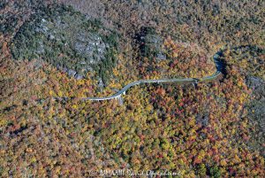 Linn Cove Viaduct on the Blue Ridge Parkway below Grandfather Mountain State Park with Autumn Colors in Western North Carolina Aerial View