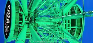 Centennial Wheel at Navy Pier in Chicago Navy Pier Centennial Wheel in Chicago, Illinois, viewed from below at blue hour with the Ferris wheel illuminated green and the Navy Pier logo visible at the center hub. Angled steel support legs, spokes and the circular wheel structure create a strong geometric view of the Dutch Wheels-designed attraction at Pier Park on the Chicago lakefront – © 2026 David Oppenheimer – Performance Impressions photography archives https://performanceimpressions.com Centennial Wheel, Navy Pier Centennial Wheel, Centennial Ferris Wheel, Centennial Wheel Chicago, Centennial Wheel Navy Pier, Navy Pier wheel, Navy Pier Ferris Wheel, Chicago Ferris wheel, Chicago wheel, Ferris wheel, observation wheel, giant wheel, wheel, Navy Pier, Navy Pier Chicago, Chicago Navy Pier, Pier Park, Navy Pier Pier Park, Ferris wheel ride, amusement ride, attraction, Chicago attraction, tourist attraction, Chicago landmark, lakefront attraction, Navy Pier logo, Navy Pier sign, center hub, wheel hub, digital hub, spokes, wheel spokes, gondolas, enclosed gondolas, passenger gondolas, support legs, wheel supports, steel supports, steel legs, steel beams, steel structure, structural steel, wheel structure, engineering, structural engineering, geometry, geometric, radial geometry, radial lines, circular, circle, symmetry, green, green lights, green lighting, green illumination, illuminated, illumination, lighting, blue hour, twilight, evening, low angle, looking up, upward view, dramatic perspective, architectural perspective, Streeterville, Streeterville Chicago, Near North Side, Chicago lakefront, Chicago waterfront, lakefront, waterfront, Lake Michigan, Grand Avenue, 600 East Grand Avenue, 600 E Grand Ave, 60611, Chicago, Chicago Illinois, Illinois, United States, USA, Dutch Wheels, Dutch Wheels BV, Netherlands, Navy Pier Inc, amusement, recreation, tourism, Chicago tourism, Chicago travel, entertainment, family attraction, outdoor attraction, city lights, night photography, blue hour photography, Ferris wheel photography, Navy Pier photography, Chicago photography, architectural photography, structural photography, travel photography, editorial photography, fine art photography, Chicago art, Navy Pier art, Ferris wheel art, photographic print, architectural print, fine art print, archival print, gallery print, collector print, wall art, licensing, image licensing, commercial imagery, photography licensing, art, print, fine art, commercial photography, David Oppenheimer, Performance Impressions, Performance Impressions photography archives, horizontal, 1-15213827141