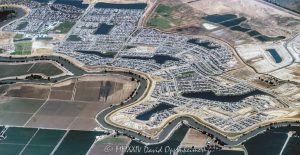 Newport at River Islands by Kiper Homes Community in Lathrop, California Aerial View Newport at River Islands by Kiper Homes Community in Lathrop, California aerial view - © 2024 David Oppenheimer - Performance Impressions aerial photography archives - https://performanceimpressions.com Newport at River Islands, Kiper Homes, River Islands, Newport, Lathrop, community, houses, homes, 95330, real estate, properties, Cambay Group, Somerston Group, Somerston, The Cambay Group, Somerston Holdings, Bay Area, farmland, neighborhood, housing, farming, layout, plan, master plan, planned community, WHA Architects, architecture, single family homes, master-planned, San Joaquin River Delta, San Joaquin River, San Joaquin County, San Joaquin, California, Capri, Cardiff, Signature Homes, Old River, custom, spec, Chantara, The Cove, Del Webb, Driftway, Hideaway, lakes, Crystal Cove, Crystal Cove Park, Somerston Park, river, Sunny’s Lake, Paradise Lake, Lake Jefferson, Latitude Park, River Island Fields, Skye, building, new, construction, development, develop, The Shores, Waypointe, agriculture, agribusiness, aerial, aerial view, aerial photography, aerial photographer, David Oppenheimer, color, horizontal, United States, 1-13985601741,