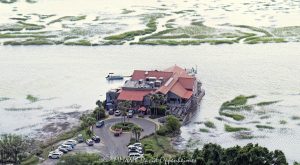 Old Oyster Factory Restaurant on Hilton Head Island Aerial View Old Oyster Factory restaurant at 101 Marshland Road on Hilton Head Island, South Carolina, aerial view - © 2024 David Oppenheimer - Performance Impressions photography archives - https://performanceimpressions.com Old Oyster Factory, Old Oyster Factory Restaurant, 101 Marshland Rd, Bram Landing, Broad Creek, creek, marsh, saltmarsh, wetlands, seafood, seafood restaurant, restaurant, oysters, raw bar, rustic, rustic-chic, dining, scenic, scenic view, waterside seating, private pier, lounge, bar, live music, music, happy hour, South Carolina, Hilton Head, Hilton Head Island, Hilton Head aerial, Town of Hilton Head, Lowcountry, Hilton Head island real estate, Hilton Head real estate, real estate, photography, aerial photographer, aerial view, aerial, building, architecture, 29928, David Oppenheimer, David Gordon Oppenheimer, United States, color, horizontal, 1-13726821381,