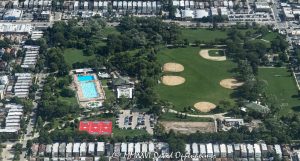 Portage Park in Chicago Aerial View Portage Park aerial photo in Chicago’s Northwest Side neighborhood shows the summer park landscape with its outdoor pool, baseball fields, athletic fields, green lawns, and surrounding residential blocks. The Chicago Park District park at 4100 North Long Avenue is a major neighborhood recreation space in the Portage Park community area – © 2026 David Oppenheimer – Performance Impressions aerial photography archives https://performanceimpressions.com Portage Park aerial photo, Portage Park Chicago, Portage Park, Portage Park in Chicago, Portage Park Chicago park, Portage Park aerial view, Portage Park aerial, 4100 N Long Ave, 4100 North Long Avenue, Chicago Park District, Chicago park, Northwest Side Chicago, Northwest Side, Portage Park neighborhood, Portage Park community area, Chicago Illinois, Chicago IL, 60641, aerial, aerial photo, aerial photography, aerial photographer, aerial view, aerial image, summer aerial, green park, urban park, city park, neighborhood park, public park, park, recreation, outdoor recreation, outdoors, sports, athletic fields, ball fields, baseball fields, baseball diamond, baseball, soccer fields, playing fields, field, open field, green space, lawns, swimming pool, outdoor pool, public pool, pool, tennis courts, playground, fieldhouse, residential neighborhood, residential blocks, houses, homes, townhomes, townhouses, row houses, residential housing, housing, real estate, Chicago real estate, residential real estate, neighborhood real estate, urban real estate, neighborhood aerial, residential aerial, park aerial, urban planning, land use, Chicago neighborhoods, urban landscape, community recreation, public recreation, summer, green, Chicago aerial, Illinois aerial, United States, licensing, image licensing, commercial imagery, photography licensing, art, print, fine art, commercial photography, David Oppenheimer, horizontal, 1-15156784411