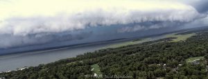 Shelf Cloud Thunderstorm Cell Over Hilton Head Island Aerial View Arcus shelf cloud thunderstorm front squall line over Calibogue Sound by Hilton Head Island, South Carolina aerial view - © 2024 David Oppenheimer - Performance Impressions photography archives - https://performanceimpressions.com shelf cloud, clouds, cloud front, front, storm, wall, thunderstorm, storm front, squall line, arcus, arcus cloud, convection, weather, Hilton Head, Hilton Head Island, Hilton Head aerial, Hilton Head Island aerial, cumulonimbus, air, atmosphere, wind, downdraft, meteorology, Hilton Head storm, Hilton Head Island weather, Hilton Head weather, Hilton Head Island Storm, aviation, flying, turbulence, wind shear, offshore, safety, conditions, helicopter, flight, FAA, NCEP, pilots, FSS, METAR, SPECI, observation, visibility, ceiling, sky, operations, logistics, Calibogue Sound, Buck Island, Broad Creek, Comfort Creek, Lawton, Lawtown Creek, Shark Bank, Bull Island, Daufuskie Island, marsh, marshlands, Long Island, Calibogue Club, Sea Pines, Stoney Creek, Calibogue Club Villas, Sea Loft Villas, Sea Loft, Fairway Oaks Villas, Fairway Oaks, Plantation Club, Plantation Club Villas, Sea Pines Resort, beach, beach access, coast, South Carolina coast, coastal, shoreline, shore, shoreline aerial, waterfront, dunes, sand, beachfront, sand dunes, vacation, vacation homes, beach houses, houses, beach homes, summer, summer homes, residences, properties, Atlantic Ocean, Hilton Head, Hilton Head Island, Town of Hilton Head, South Carolina, coastline, coastline aerial, luxury, Lowcountry, Hilton head island real estate, Hilton Head real estate, real estate, Hilton Head aerial, aerial photographer, aerial photography, photography, aerial view, aerial, 29928, David Oppenheimer, David Gordon Oppenheimer, United States, color, horizontal, 1-13726821381,