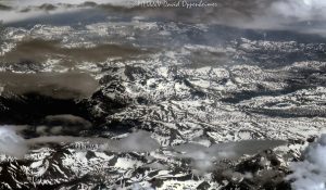 Sierra Nevada Mountains in California with Snow and Clouds Aerial View Sierra Nevada Mountains in California with snow and clouds aerial view - © 2024 David Oppenheimer - Performance Impressions aerial photography archives - https://performanceimpressions.com Sierra Nevada Mountains, Sierra Nevada, Sierra Nevada Mountains aerial, Sierra Nevada Mountain Range, Sierras, snow, clouds, snow cover, summer, snowpack, wilderness, nature, mountains, travel, altitude, mountain range, American Cordillera, watershed, Central Valley, California, beauty, elevation, climate, atmosphere, serene, art, aerial, aerial view, aerial photography, aerial photographer, David Oppenheimer, color, horizontal, United States, 1-13985601741,