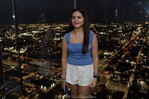 Skydeck Chicago Ledge at Willis Tower Skydeck Chicago’s Ledge at Willis Tower shows a person inside the glass observation box at night, with transparent floor panels, glass walls, and Chicago city lights beyond the 103rd-floor view. Located at 233 South Wacker Drive, the landmark skyscraper was formerly known as Sears Tower and remains one of Chicago’s best-known observation deck attractions – © 2026 David Oppenheimer – Performance Impressions photography archives https://performanceimpressions.com Skydeck Chicago, Skydeck Chicago Ledge, The Ledge, Willis Tower Skydeck, Willis Tower Ledge, Willis Tower, Sears Tower, former Sears Tower, Sears Tower Chicago, Willis Tower Chicago, 233 S Wacker Drive, 233 South Wacker Drive, 233 S Wacker Dr, South Wacker Drive, Wacker Drive, Chicago Loop, Loop Chicago, downtown Chicago, Chicago Illinois, Chicago IL, 60606, observation deck, observation, deck, glass observation deck, glass ledge, glass box, glass floor, glass walls, glass balcony, transparent floor, transparent walls, glass, floor, walls, night, nighttime, night photography, city lights, Chicago night, Chicago city lights, city view, skyline, skyline view, Chicago skyline, view, lookout, overlook, attraction, experience, vacation, tourism, travel, sightseeing, tourist, tourists, person, silhouette, standing, interior, tower, skyscraper, high rise, building, architecture, architectural photography, Chicago architecture, commercial architecture, modern architecture, Skidmore Owings Merrill, Skidmore Owings & Merrill, SOM, Bruce Graham, Fazlur Rahman Khan, Blackstone, EQ Office, real estate, Chicago real estate, landmark, Chicago landmark, United States, licensing, image licensing, commercial imagery, photography licensing, art, print, fine art, commercial photography, David Oppenheimer, horizontal, 1-15156784411