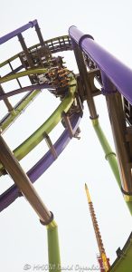 THE JOKER Free-Fly Coaster at Six Flags Great America near Chicago THE JOKER Free-Fly Coaster at Six Flags Great America near Chicago in Gurnee, Illinois, shown in close-up with The Joker character theming in the foreground and a coaster car flipping overhead on the attraction’s green-and-purple track. The DC Universe thrill ride is an S&S Worldwide 4D Free Spin coaster using exposed wing seating and magnetic spin-control technology to rotate riders head-over-heels – © 2026 David Oppenheimer – Performance Impressions photography archives https://performanceimpressions.com THE JOKER Free-Fly Coaster, THE JOKER Free Fly Coaster, Joker Free-Fly Coaster, Joker Free Fly Coaster, THE JOKER, The Joker, Joker, Joker coaster, Joker roller coaster, Joker ride, Six Flags Joker, Joker Six Flags, Six Flags Great America Joker, Great America Joker, Joker Chicago, Joker Illinois, DC Joker, DC Comics Joker, Joker character, Joker figure, Joker theming, Joker theme, Joker display, Joker face, Joker sign, Joker signage, supervillain, DC supervillain, villain, comic villain, comic book villain, comic character, DC Comics, DC, DC Universe, Six Flags DC Universe, DC Universe Six Flags, Great America DC Universe, DC Universe Chicago, DC Universe Illinois, roller coaster, roller coasters, coaster, coasters, steel coaster, steel roller coaster, 4D coaster, 4D roller coaster, 4D Free Spin, 4D Free Spin coaster, S&S 4D Free Spin, free spin, free-spin coaster, free fly, free-fly coaster, freestyle coaster, thrill coaster, thrill ride, thrill rides, amusement ride, theme park ride, ride, rides, coaster car, coaster vehicle, ride vehicle, winged vehicle, winged seats, wing seating, exposed seating, spinning coaster, spinning vehicle, flipping coaster, flipping riders, head-over-heels, head over heels, flips, flipping, spin, spinning, rotation, rotating seats, inversions, inversion, weightlessness, free fall, freefall, 90-degree hill, vertical lift, coaster track, roller coaster track, track, stacked track, overhead track, overhead coaster, coaster overhead, riders overhead, green track, purple track, green and purple, amusement park, theme park, amusement parks, theme parks, amusement park attraction, theme park attraction, coaster attraction, park attraction, attraction, attractions, themed attraction, themed entertainment, themed design, comic-book theme, comic theme, S&S Worldwide, S&S, S and S Worldwide, S&S Worldwide Inc, S&S coaster, S&S roller coaster, coaster manufacturer, ride manufacturer, amusement manufacturer, ride engineering, coaster engineering, engineering, engineer, amusement engineering, magnetic spin control, magnetic spin, magnetic technology, spin control, magnetic braking, eddy current, eddy current brake, ride technology, coaster technology, Todd Snyder, Mike Worley, Alan Schilke, coaster designer, ride designer, amusement design, Bleck & Bleck Architects, Bleck and Bleck Architects, Bleck Architects, Bleck & Bleck, theme park architect, theme park architecture, architect, architects, architecture, architectural design, theme park design, ride integration, attraction integration, theme integration, concept integration, land planning, marquee design, lighting design, ride structures, structural design, control systems, control integration, electrical integration, Yankee Harbor, Six Flags Yankee Harbor, DC Universe, Six Flags Great America, Six Flags Great America Chicago, Great America Chicago, Great America Illinois, Six Flags Chicago, Six Flags Illinois, Six Flags, Great America, Gurnee, Gurnee Illinois, Gurnee IL, Illinois, Lake County, Lake County Illinois, northern Illinois, Chicagoland, Chicago area, Chicago, Chicago Illinois, Chicago theme park, Chicago amusement park, Chicago attraction, Chicago attractions, Chicago tourism, Chicago travel, Visit Chicago, Illinois attraction, Illinois attractions, Illinois tourism, Illinois travel, Visit Illinois, Midwest, Midwest attraction, Midwest amusement park, Midwest theme park, Great America Parkway, 1 Great America Parkway, Grand Avenue, Route 132, Interstate 94, I-94, 60031, United States, USA, Six Flags Entertainment Corporation, Six Flags Entertainment, Six Flags company, Six Flags stock, FUN, NYSE FUN, Sansei Technologies, Sansei Group, Sansei, TSE 6357, 6357, amusement park photography, theme park photography, roller coaster photography, coaster photography, thrill ride photography, action photography, Joker photography, DC photography, entertainment photography, travel photography, tourism photography, editorial photography, commercial photography, fine art photography, amusement park art, theme park art, roller coaster art, Joker art, DC art, Six Flags art, Great America art, Chicago art, roller coaster print, Joker print, Six Flags print, Great America print, photographic print, fine art print, archival print, gallery print, collector print, wall art, licensing, image licensing, commercial imagery, photography licensing, art, print, fine art, commercial photography, David Oppenheimer, Performance Impressions, Performance Impressions photography archives, 1-15156784411