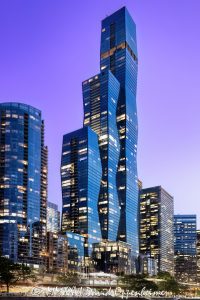 The St. Regis Chicago Glass Tower at Twilight The St. Regis Chicago at 401 East Upper Wacker Drive rises above Lakeshore East at twilight, its illuminated windows articulating three interconnected volumes of blue-green glass against a purple post-sunset sky. Viewed from the Chicago River, the 101-story luxury hotel and condominium tower designed by Jeanne Gang of Studio Gang forms a sculptural landmark near Lake Michigan in Chicago, Illinois – © 2026 David Oppenheimer – Performance Impressions photography archives https://performanceimpressions.com The St. Regis Chicago, St. Regis Chicago, The St. Regis Chicago Hotel, St. Regis Hotel Chicago, The Residences at The St. Regis Chicago, St. Regis Chicago Residences, St. Regis Hotels & Resorts, 401 East Upper Wacker Drive, 401 E Upper Wacker Drive, 401 E Upper Wacker Dr, 401 East Wacker Drive, 401 E Wacker Drive, 363 East Wacker Drive, 363 E Wacker Drive, Vista Tower, Vista Tower Chicago, Wanda Vista Tower, Lakeshore East, Lakeshore East Chicago, New Eastside, Chicago Loop, Loop Chicago, downtown Chicago, East Wacker Drive, Upper Wacker Drive, Wacker Drive, Chicago River, Chicago Riverwalk, Riverwalk, riverfront, Lake Michigan, Chicago lakefront, DuSable Harbor, Navy Pier, Millennium Park, Chicago, Chicago Illinois, Chicago IL, Illinois, 60601, facade, building exterior, exterior, tower exterior, upper tower, glass facade, glass tower, glass towers, glass skyscraper, glass curtain wall, curtain wall, blue-green glass, gradient glass, aqua glass, reflective glass, high-performance glass, faceted facade, sculptural facade, geometric facade, three-volume tower, interconnected volumes, three towers, stacked frustums, frustum geometry, truncated pyramids, stepped edges, tapered tower, illuminated facade, illuminated windows, building lights, window lights, facade lighting, city lights, reflections, twilight, Chicago twilight, purple twilight, purple sky, post-sunset sky, dusk, after sunset, evening, skyline lights, luxury hotel, five-star hotel, Chicago hotel, Chicago luxury hotel, downtown hotel, riverfront hotel, Lake Michigan hotel, Marriott hotel, hotel tower, hotel, hospitality, luxury hospitality, St. Regis Butler Service, Marriott International, Marriott Bonvoy, Marriott stock, NASDAQ MAR, MAR stock, mixed-use tower, mixed-use building, condominium tower, residential tower, condominiums, luxury condos, luxury residences, Chicago condos, Lakeshore East condos, skyscraper, supertall, high rise, tower, building, 101-story tower, Chicago skyline, Chicago cityscape, skyline, cityscape, urban, city views, river views, lake views, real estate, Chicago real estate, Lakeshore East real estate, hotel real estate, hospitality real estate, condominium real estate, residential real estate, luxury real estate, riverfront real estate, commercial real estate, contemporary architecture, modern architecture, sculptural architecture, geometric architecture, high-rise architecture, riverfront architecture, Chicago architecture, architectural photography, architecture, engineering, structural engineering, wind engineering, reinforced concrete, blow-through floor, tuned liquid dampers, Studio Gang, Jeanne Gang, bKL Architecture, bKL Architects, Gensler, HBA, Magnusson Klemencic Associates, MKA, McHugh Construction, Power Construction, OLIN, Magellan Development Group, Gencom, GD Holdings, Gencom GD Holdings, hotel ownership, hotel investment, boat view, river view, Chicago River cruise, architecture cruise, urban photography, twilight photography, hotel photography, United States, licensing, image licensing, commercial imagery, photography licensing, art, print, fine art, commercial photography, David Oppenheimer, vertical, 1-15213827141