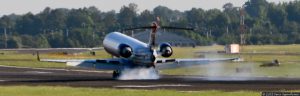 Jet Plane Landing on Runway with Tires Smoking