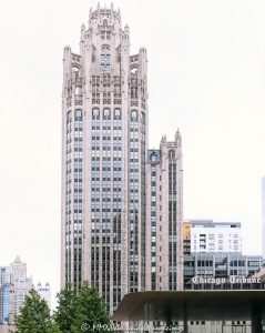 Tribune Tower in Chicago Tribune Tower at 435 North Michigan Avenue in Chicago shows the ornate neo-Gothic tower, limestone facade, Gothic crown, and architectural detailing of the former Chicago Tribune headquarters. Designed by John Mead Howells and Raymond Hood, the landmark tower has been converted into Tribune Tower Residences, a luxury condominium property developed by CIM Group and Golub & Company, with Rowan visible at Michigan Avenue street level – © 2026 David Oppenheimer – Performance Impressions photography archives https://performanceimpressions.com Tribune Tower, Tribune Tower Chicago, Tribune Tower Residences, Tribune Tower condos, Tribune Tower condominiums, 435 N Michigan Ave, 435 North Michigan Avenue, 435 N Michigan Avenue, North Michigan Avenue, Michigan Avenue, Magnificent Mile, Mag Mile, Chicago Loop, Streeterville, downtown Chicago, Chicago Illinois, Chicago IL, 60611, facade, building exterior, exterior, tower, Gothic tower, neo-Gothic tower, ornate tower, limestone facade, stone facade, Gothic facade, neo-Gothic facade, Gothic crown, architectural detail, ornate facade, historic facade, carved stone, buttresses, tracery, skyscraper, high rise, landmark building, Chicago Landmark, historic building, newspaper building, former headquarters, Chicago Tribune, Chicago Tribune Tower, Tribune Company, Tribune Media, Tribune Publishing, WGN Radio, real estate, Chicago real estate, luxury real estate, residential real estate, condominium tower, condo tower, luxury condos, condominiums, luxury residences, residential conversion, adaptive reuse, architecture, architectural photography, Chicago architecture, historic architecture, Gothic architecture, Gothic Revival, neo-Gothic architecture, commercial architecture, residential architecture, John Mead Howells, Raymond Hood, Howells and Hood, Howells & Hood, Rene Paul Chambellan, CIM Group, Golub and Company, Golub & Company, Rowan, Rowan Michigan Ave, Rowan Chicago, Tower District, Michigan Avenue retail, Chicago history, journalism history, Illinois architecture, United States, licensing, image licensing, commercial imagery, photography licensing, art, print, fine art, commercial photography, David Oppenheimer, vertical, 1-15213827141