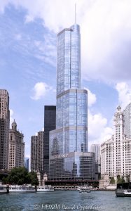 Trump International Hotel and Tower Chicago Trump International Hotel and Tower Chicago at 401 North Wabash Avenue rises along the Chicago River in River North, with the river and Wendella West Docks visible in the foreground. Designed by Skidmore, Owings & Merrill with Adrian Smith as lead architect and structural engineering by William F. Baker, the glass and stainless-steel mixed-use skyscraper includes hotel rooms, condominiums, retail space, and parking – © 2026 David Oppenheimer – Performance Impressions photography archives https://performanceimpressions.com