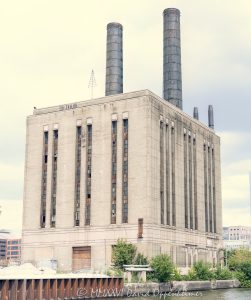Chicago Union Station Power House on the Chicago River Chicago Union Station Power House at 301 West Taylor Street stands along the South Branch of the Chicago River, showing its Art Moderne industrial facade, massive brick volume, vertical window bands, and twin smokestacks. Designed by Graham, Anderson, Probst & White for the Chicago Union Station Company, the former power and boiler plant supplied steam and electricity for railroad infrastructure and has been the focus of preservation efforts against proposed demolition – © 2026 David Oppenheimer – Performance Impressions photography archives https://performanceimpressions.com Chicago Union Station Power House, Union Station Power House, Union Station Powerhouse, Union Station Boiler Plant, Chicago Union Station Boiler Plant, 301 W Taylor Street, 301 West Taylor Street, 301 W Taylor St, West Taylor Street, Taylor Street, South Loop, South Loop Chicago, downtown Chicago, Chicago Illinois, Chicago IL, 60607, Chicago River, river, South Branch Chicago River, riverfront, waterfront, Chicago riverfront, Chicago waterfront, facade, building exterior, exterior, Art Moderne, Art Deco, Art Moderne facade, Art Deco facade, industrial facade, brick facade, cream brick, brick building, smokestacks, chimneys, twin smokestacks, vertical windows, window bands, industrial building, power house, powerhouse, power plant, boiler plant, steam plant, coal fired plant, utility building, utilities, electricity, steam, electrical power, railroad power, rail infrastructure, train infrastructure, transportation infrastructure, railroad building, railway building, historic building, historic landmark, industrial landmark, endangered building, threatened building, preservation, historic preservation, adaptive reuse, demolition threat, Amtrak, National Railroad Passenger Corporation, Chicago Union Station, Union Station Chicago, Chicago Union Station Company, CUSCo, rail history, railroad history, Chicago railroads, architecture, architectural photography, Chicago architecture, industrial architecture, Art Deco architecture, historic architecture, riverfront architecture, Graham Anderson Probst White, Graham Anderson Probst & White, Daniel Burnham legacy, photorealism, photorealistic, painterly, painterly effect, Illinois architecture, United States, licensing, image licensing, commercial imagery, photography licensing, art, print, fine art, commercial photography, David Oppenheimer, vertical, 1-15156784411